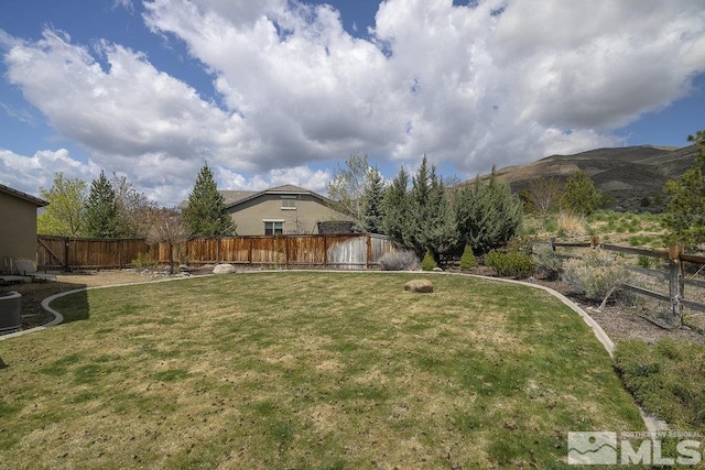 view of yard with a mountain view and cooling unit