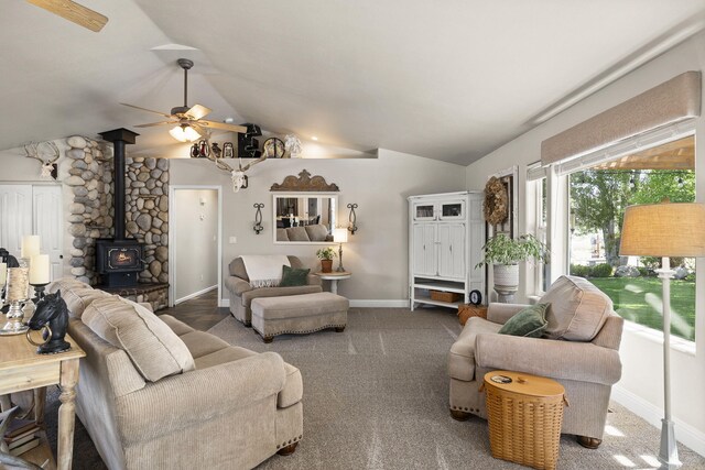 4800 Amy Rd, Reno, NV 89510 - carpeted living area with a wood stove, vaulted ceiling, ceiling fan, and baseboards