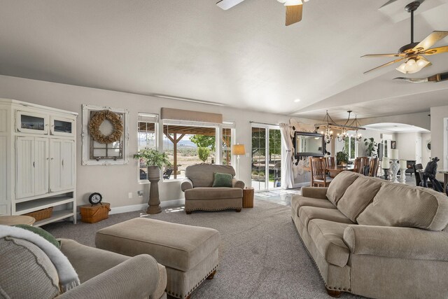 4800 Amy Rd, Reno, NV 89510 - carpeted living room with ceiling fan, arched walkways, a chandelier, vaulted ceiling, and baseboards