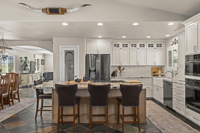 4800 Amy Rd, Reno, NV 89510 - kitchen with stainless steel fridge, recessed lighting, dishwashing machine, a center island, and backsplash