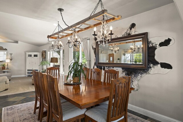 4800 Amy Rd, Reno, NV 89510 - dining space featuring a chandelier, plenty of natural light, lofted ceiling, baseboards, and stone finish flooring