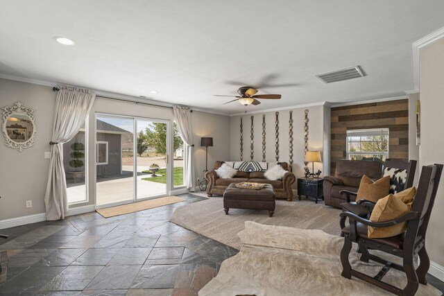 4800 Amy Rd, Reno, NV 89510 - living area featuring ornamental molding, stone tile flooring, ceiling fan, healthy amount of natural light, and baseboards