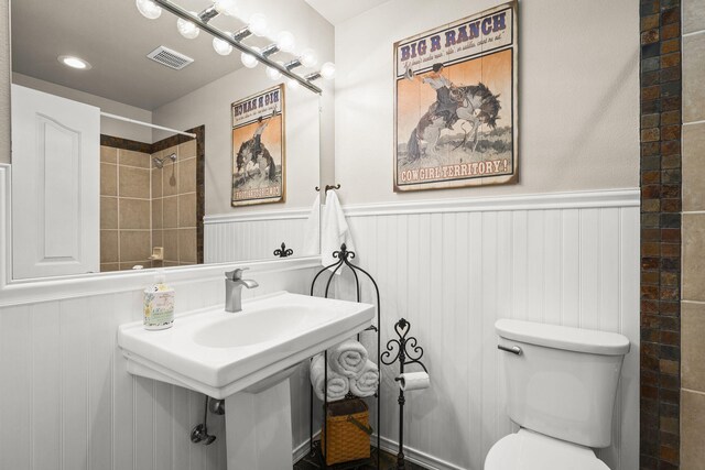 4800 Amy Rd, Reno, NV 89510 - bathroom with a wainscoted wall, toilet, a decorative wall, and a shower