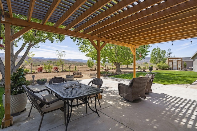 4800 Amy Rd, Reno, NV 89510 - view of patio featuring a mountain view, a pergola, and outdoor dining space