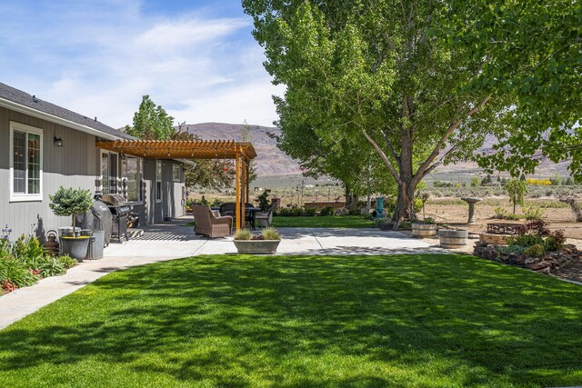 4800 Amy Rd, Reno, NV 89510 - view of green lawn with a pergola and a patio area