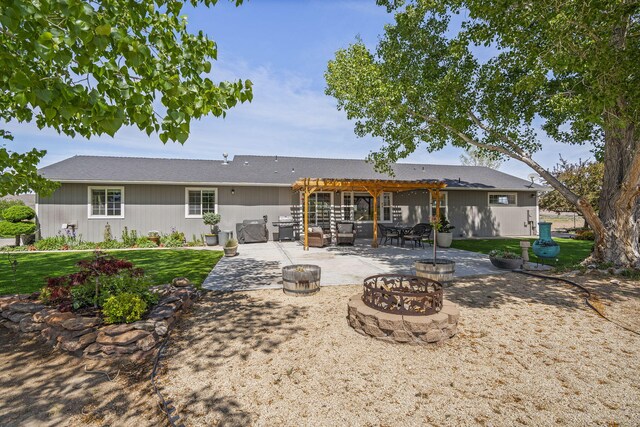 4800 Amy Rd, Reno, NV 89510 - rear view of property with an outdoor fire pit, a pergola, a patio, and a lawn