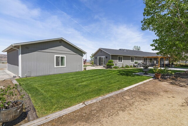 4800 Amy Rd, Reno, NV 89510 - back of house with a yard and a patio area