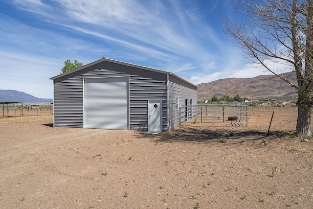 4800 Amy Rd, Reno, NV 89510 - detached garage featuring a mountain view and fence
