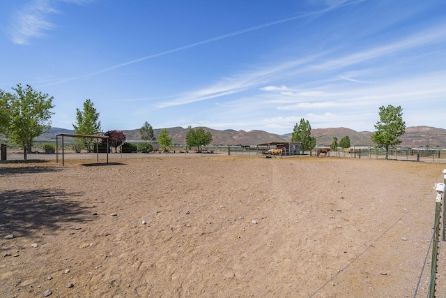4800 Amy Rd, Reno, NV 89510 - view of yard featuring a mountain view, fence, and a carport