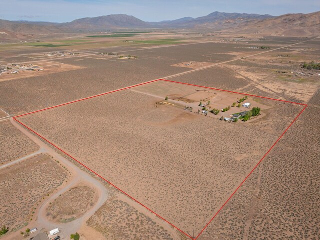 4800 Amy Rd, Reno, NV 89510 - aerial view of sparsely populated area with property boundaries highlighted, mountains, and a desert landscape