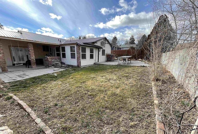 50 Bellevue Ave, Winnemucca, NV 89445 - back of property featuring a patio area and metal roof