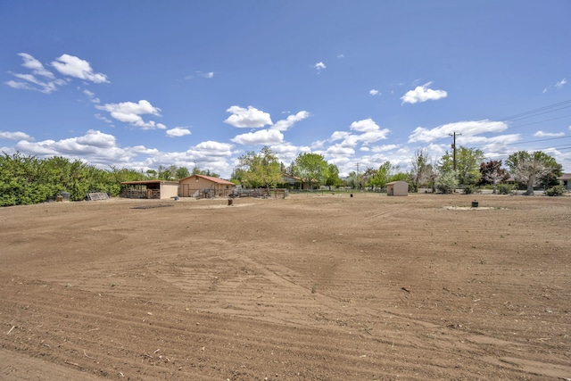 1000 Sagebrush Ct, Gardnerville, NV 89460 - view of yard with an outbuilding and fence