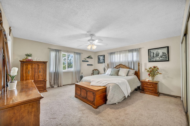 1000 Sagebrush Ct, Gardnerville, NV 89460 - bedroom featuring light colored carpet, a textured ceiling, a ceiling fan, and a closet