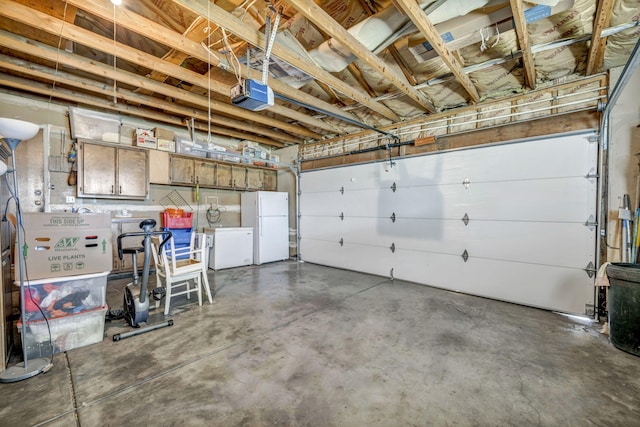 1000 Sagebrush Ct, Gardnerville, NV 89460 - garage with freestanding refrigerator, a garage door opener, and fridge