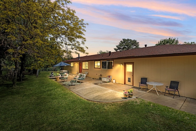295 Andrew Ln, Reno, NV 89521 - back of property featuring a patio and a lawn