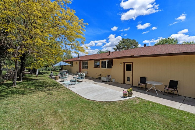 295 Andrew Ln, Reno, NV 89521 - rear view of house with a patio area and a lawn