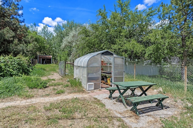 295 Andrew Ln, Reno, NV 89521 - view of yard featuring a greenhouse and an outdoor structure