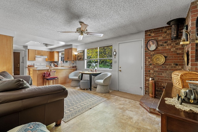 295 Andrew Ln, Reno, NV 89521 - living room with ceiling fan, a wood stove, light floors, and a textured ceiling