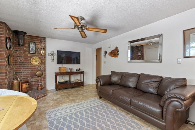 295 Andrew Ln, Reno, NV 89521 - living room featuring a ceiling fan, a wood stove, and a textured ceiling