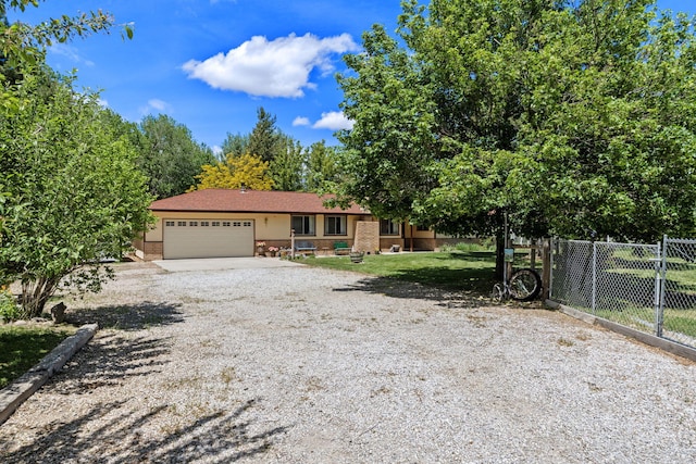 295 Andrew Ln, Reno, NV 89521 - view of front of property featuring an attached garage and gravel driveway