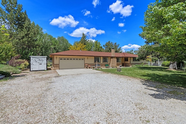 295 Andrew Ln, Reno, NV 89521 - ranch-style home featuring a garage, concrete driveway, a chimney, and a front yard