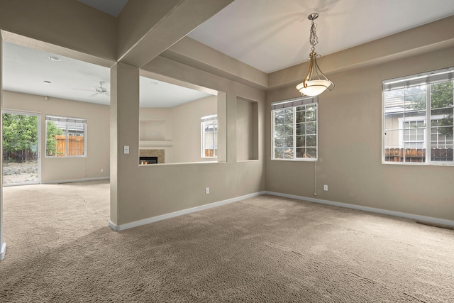 1196 Turnberry Dr, Sparks, NV 89436 - carpeted empty room with a fireplace, ceiling fan, and baseboards