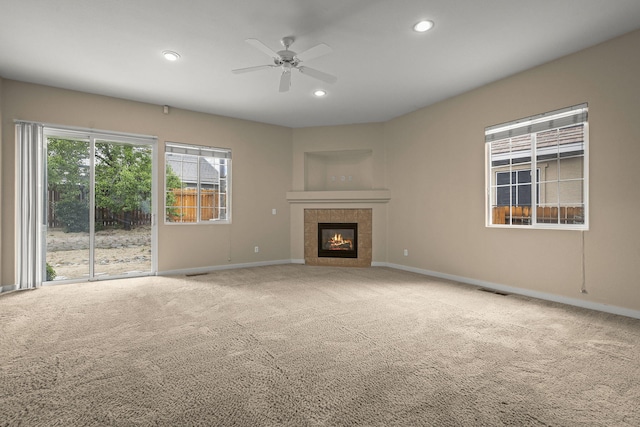 1196 Turnberry Dr, Sparks, NV 89436 - unfurnished living room featuring baseboards, carpet flooring, ceiling fan, recessed lighting, and a tile fireplace