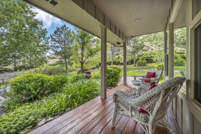 3150 Kings Canyon Rd, Carson City, NV 89703 - wooden porch with view of wooded area