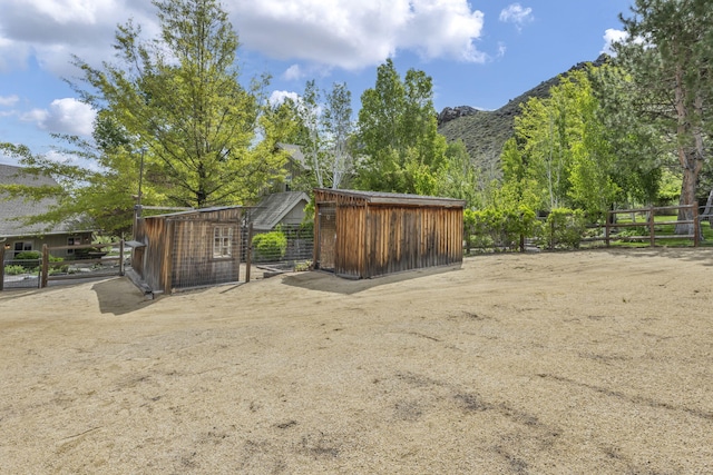 3150 Kings Canyon Rd, Carson City, NV 89703 - view of yard featuring an outdoor structure and a mountain view
