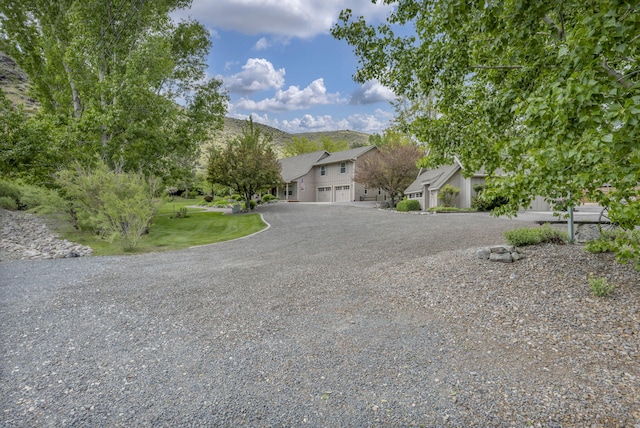 3150 Kings Canyon Rd, Carson City, NV 89703 - view of front of home with driveway and a garage