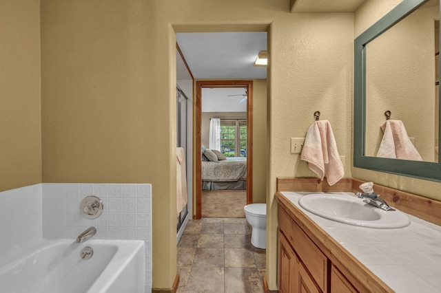 3150 Kings Canyon Rd, Carson City, NV 89703 - full bath with a bath, vanity, toilet, a textured wall, and baseboards