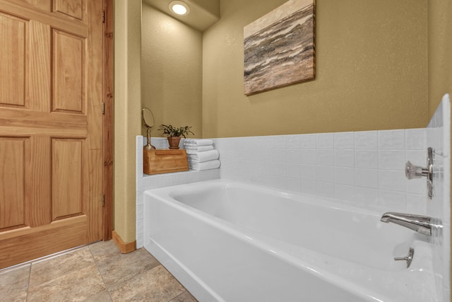 3150 Kings Canyon Rd, Carson City, NV 89703 - full bathroom with a textured wall, a bath, and baseboards