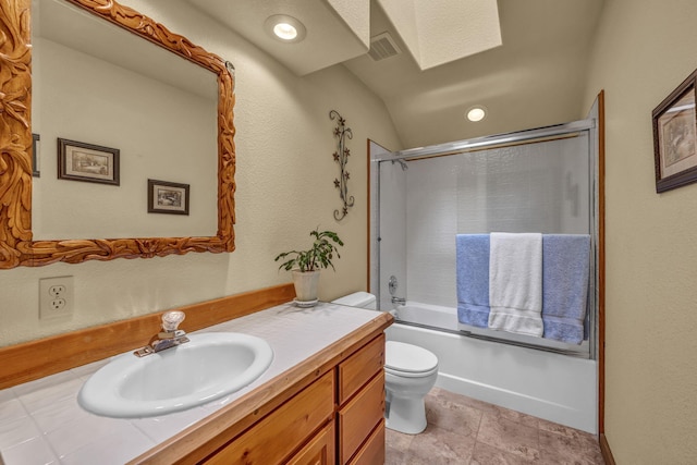3150 Kings Canyon Rd, Carson City, NV 89703 - bathroom featuring toilet, vanity, combined bath / shower with glass door, a skylight, and lofted ceiling