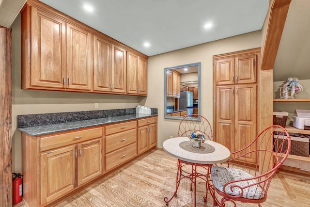 3150 Kings Canyon Rd, Carson City, NV 89703 - kitchen with recessed lighting, light wood-style floors, baseboards, and freestanding refrigerator