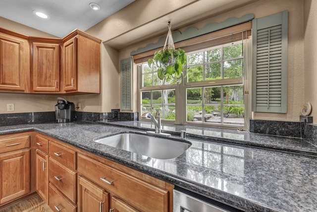 3150 Kings Canyon Rd, Carson City, NV 89703 - kitchen featuring a sink, dark stone countertops, brown cabinetry, and recessed lighting