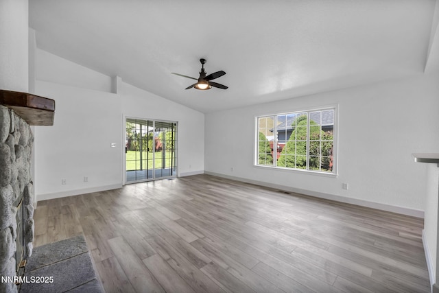 185 Windtree Cir, Carson City, NV 89701 - unfurnished living room with a ceiling fan, vaulted ceiling, wood finished floors, and baseboards