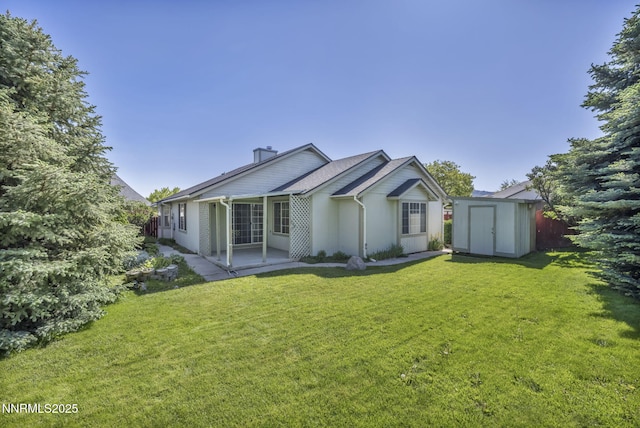 185 Windtree Cir, Carson City, NV 89701 - back of house with a yard, a patio area, and a chimney