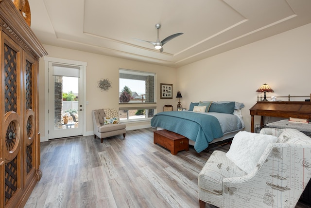1023 Sun Crest Ct, Gardnerville, NV 89460 - bedroom featuring a raised ceiling, access to outside, wood finished floors, and ceiling fan