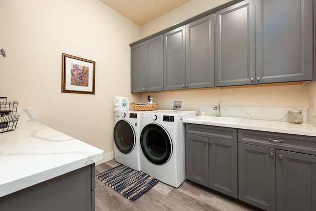 1023 Sun Crest Ct, Gardnerville, NV 89460 - laundry area featuring cabinet space, washer and dryer, and light wood-type flooring