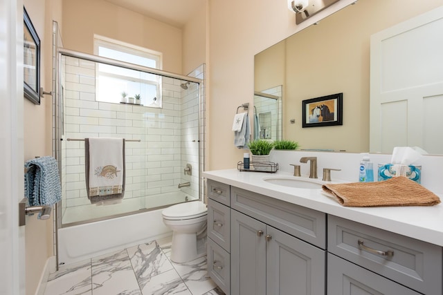 1023 Sun Crest Ct, Gardnerville, NV 89460 - bathroom featuring toilet, vanity, marble look tiles, and shower / bath combination with glass door