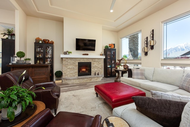 1023 Sun Crest Ct, Gardnerville, NV 89460 - living area featuring wood finished floors, a fireplace, and a tray ceiling