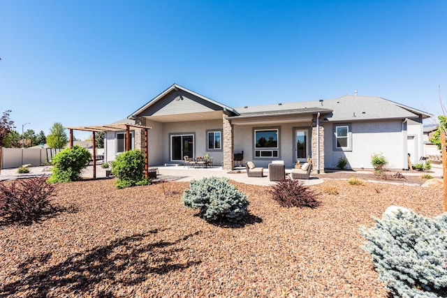 1023 Sun Crest Ct, Gardnerville, NV 89460 - back of house with stucco siding, an outdoor hangout area, fence, a patio, and stone siding