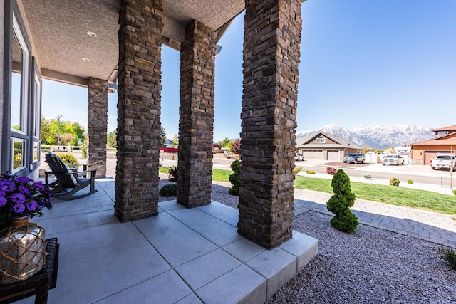 1023 Sun Crest Ct, Gardnerville, NV 89460 - view of patio / terrace featuring a mountain view and covered porch