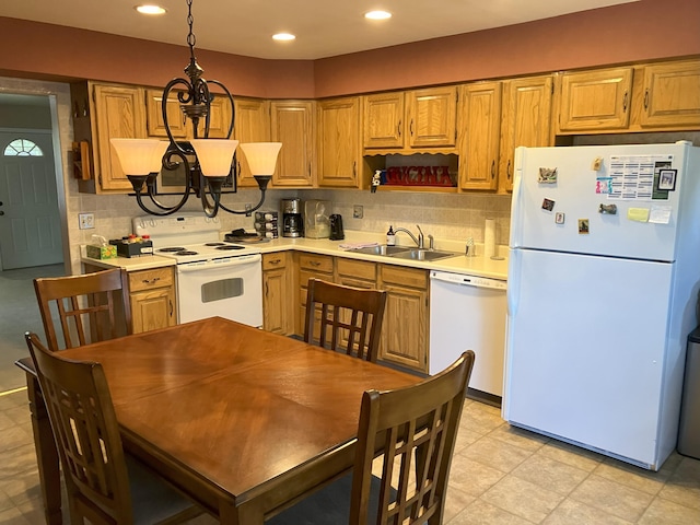 3260 Lucerne Way, Sparks, NV 89431 - kitchen with white appliances, a sink, a chandelier, tasteful backsplash, and recessed lighting
