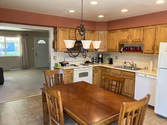 3260 Lucerne Way, Sparks, NV 89431 - kitchen featuring white appliances, a sink, a chandelier, light countertops, and backsplash