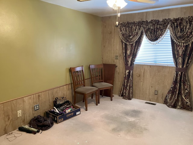 3260 Lucerne Way, Sparks, NV 89431 - living area featuring wooden walls, ceiling fan, carpet flooring, and wainscoting