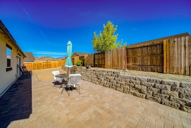 1390 Tule Peak Cir, Carson City, NV 89701 - view of patio / terrace featuring a fenced backyard and outdoor dining space