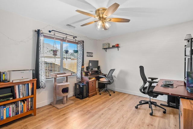 1390 Tule Peak Cir, Carson City, NV 89701 - home office featuring wood finished floors, a ceiling fan, and baseboards