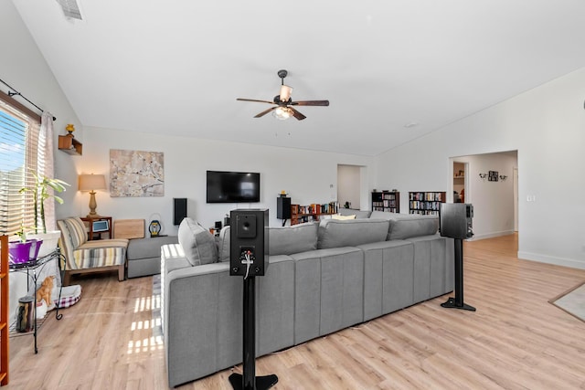 1390 Tule Peak Cir, Carson City, NV 89701 - living room with vaulted ceiling, light wood-type flooring, ceiling fan, and baseboards