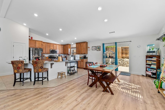 1390 Tule Peak Cir, Carson City, NV 89701 - dining room with lofted ceiling, light wood-style flooring, recessed lighting, and baseboards